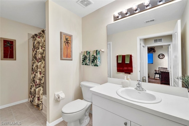 bathroom with tile floors, toilet, and oversized vanity