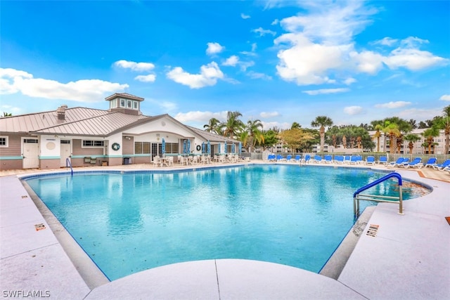 view of swimming pool featuring a patio area