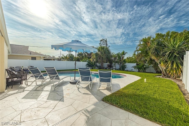 view of patio with a fenced in pool