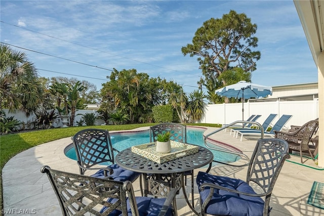 view of swimming pool featuring a patio area