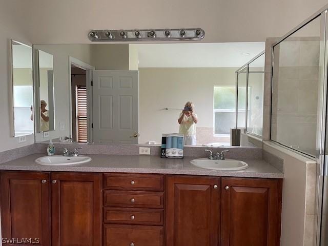 bathroom with vanity and an enclosed shower