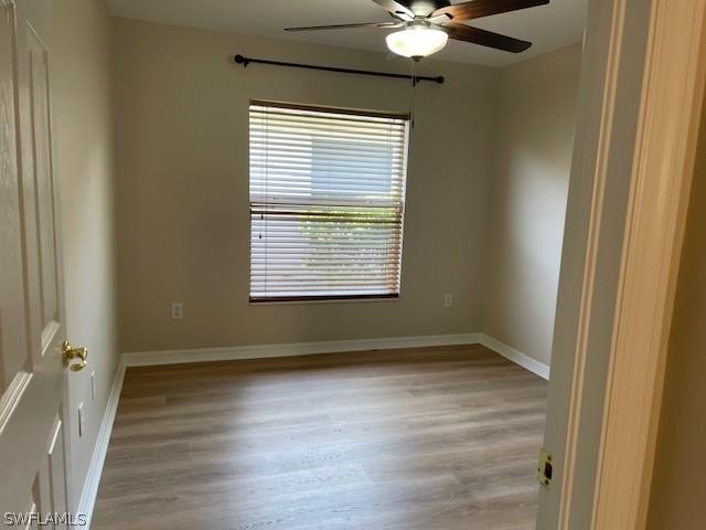 spare room with ceiling fan and light hardwood / wood-style flooring