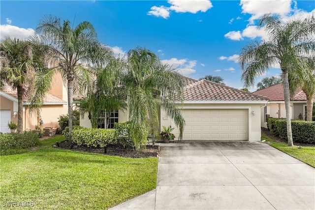 view of front of house with a garage and a front yard