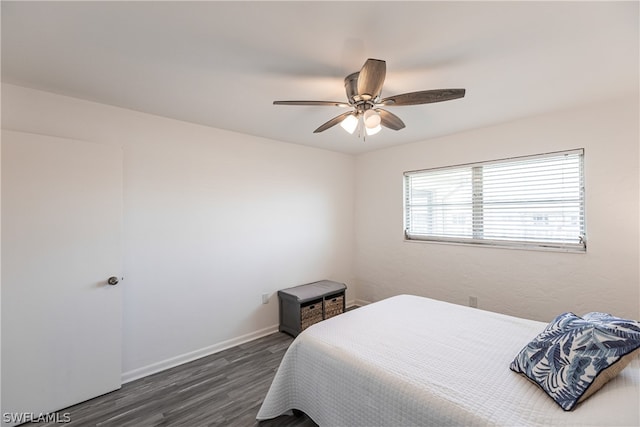 bedroom featuring ceiling fan and dark hardwood / wood-style floors