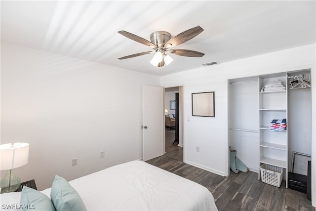 bedroom featuring a closet, ceiling fan, and dark wood-type flooring