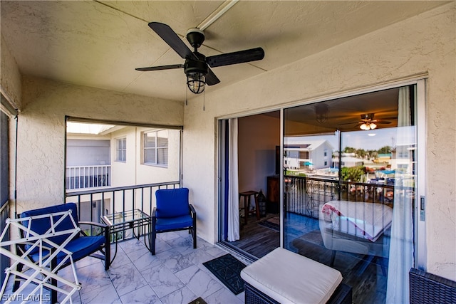 sunroom featuring ceiling fan