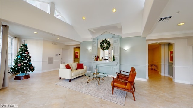 living room featuring ornamental molding, decorative columns, vaulted ceiling, and light tile patterned flooring