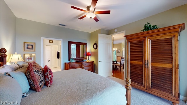 bedroom with ceiling fan and ensuite bathroom