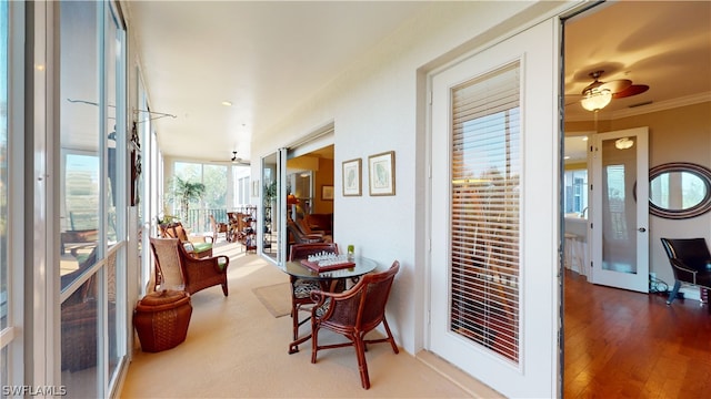 hallway featuring french doors, crown molding, and wood-type flooring