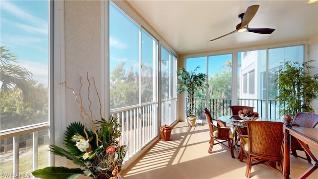 sunroom / solarium with ceiling fan and plenty of natural light