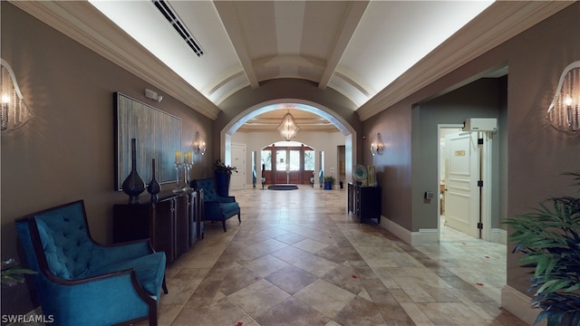 hallway featuring lofted ceiling and ornamental molding