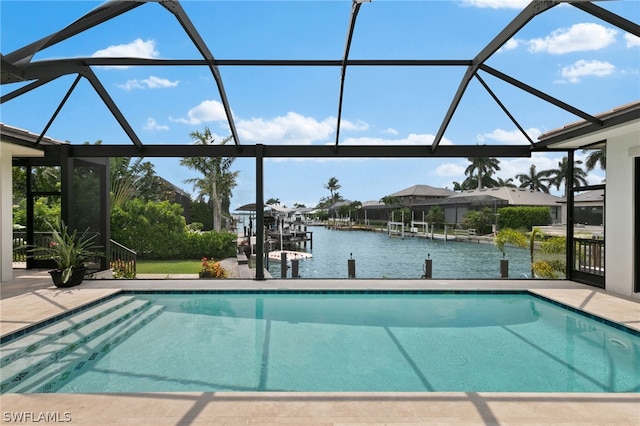 view of pool with a boat dock, a water view, and glass enclosure