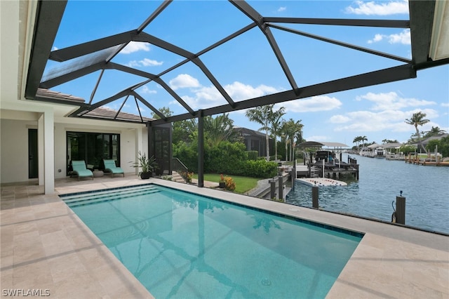 view of pool with a water view, glass enclosure, a patio area, and a dock