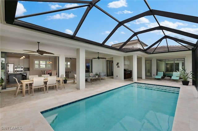 back of property featuring a patio, an outdoor living space, glass enclosure, and ceiling fan