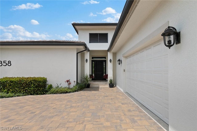 property entrance featuring a garage