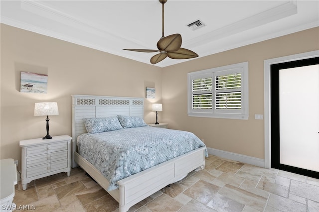 bedroom featuring ceiling fan and ornamental molding