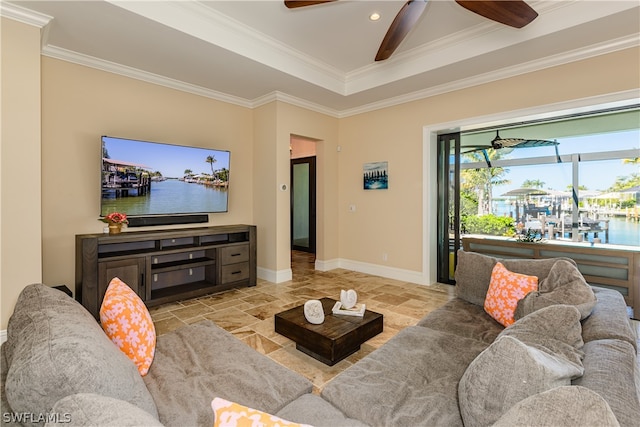 living room featuring a water view and ornamental molding