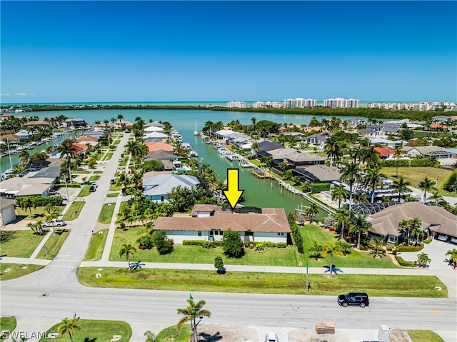 birds eye view of property featuring a water view