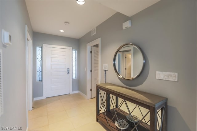 foyer entrance with light tile floors