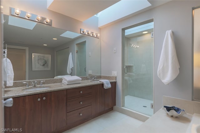 bathroom with an enclosed shower, tile floors, and dual vanity