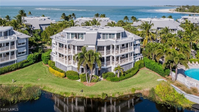 birds eye view of property featuring a water view