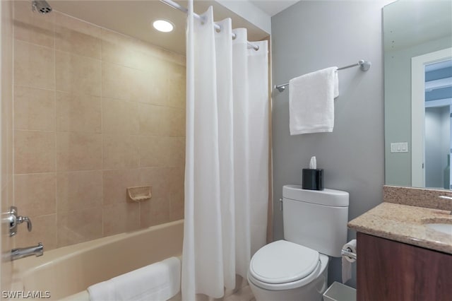 full bathroom featuring shower / bathtub combination with curtain, toilet, and vanity