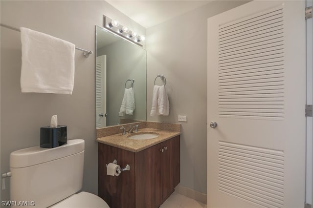 bathroom featuring toilet and vanity