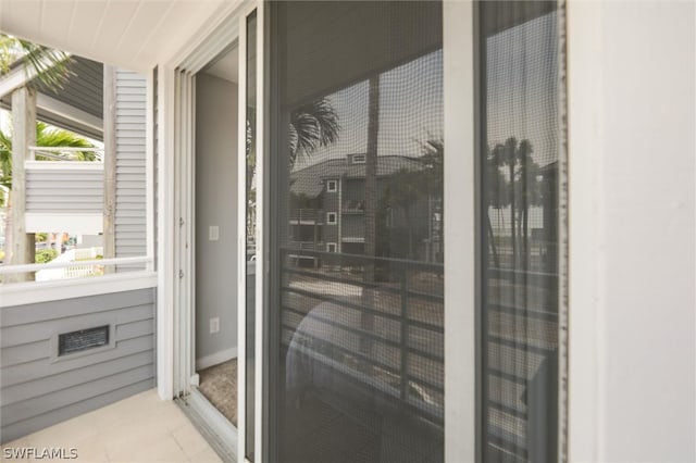 exterior space featuring light tile flooring