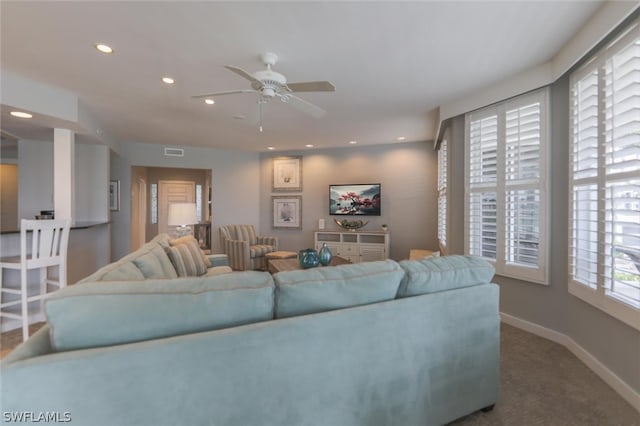 living room featuring ceiling fan and carpet floors