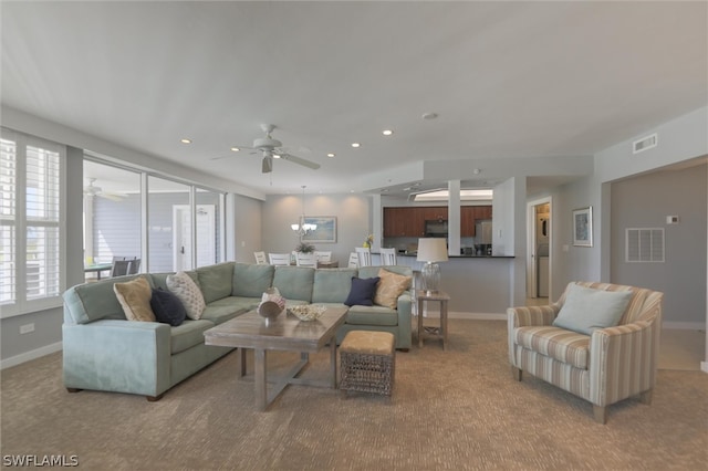 living room featuring ceiling fan and carpet flooring