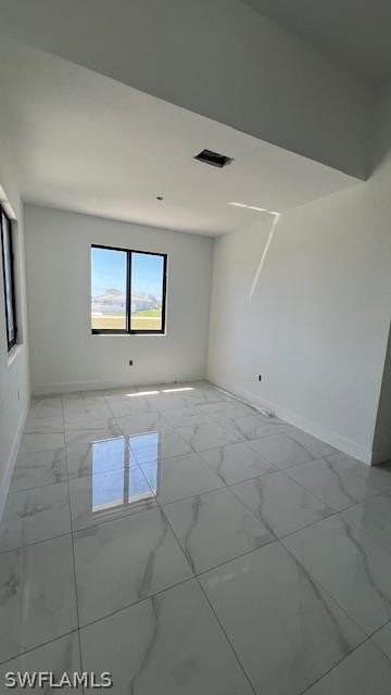 view of tiled spare room