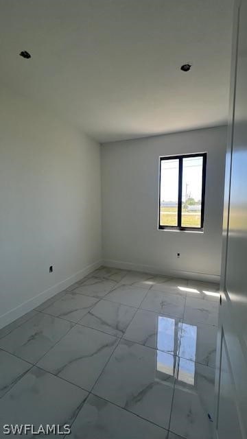 view of tiled spare room