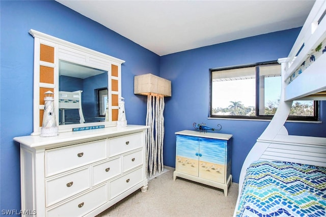 bedroom featuring light colored carpet