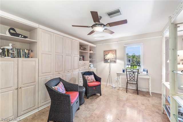 sitting room with ceiling fan