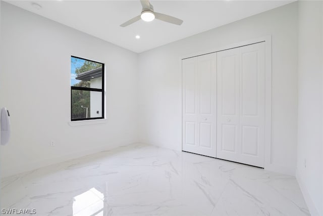 unfurnished bedroom with a closet, ceiling fan, and light tile patterned floors