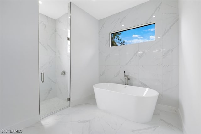 bathroom featuring shower with separate bathtub, tile patterned floors, and tile walls