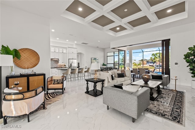 living room with beam ceiling and coffered ceiling