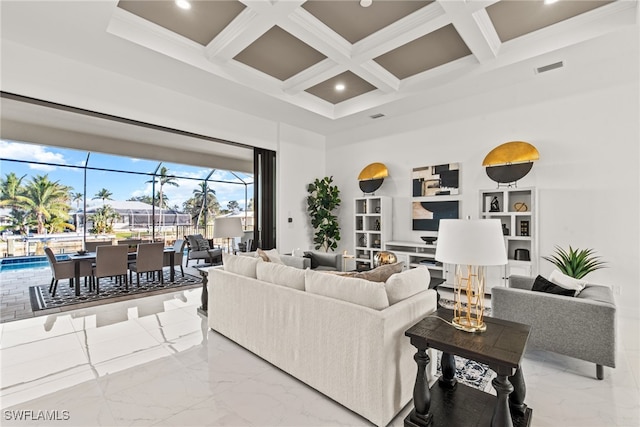 living room with beamed ceiling, a towering ceiling, crown molding, and coffered ceiling