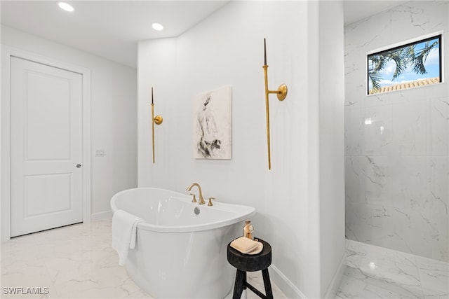 bathroom featuring separate shower and tub