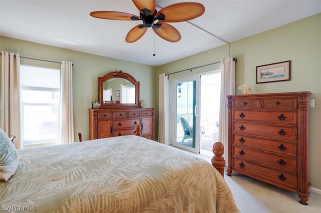 carpeted bedroom featuring ceiling fan and access to outside