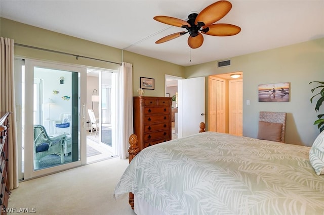 bedroom featuring access to outside, a closet, ceiling fan, and light carpet