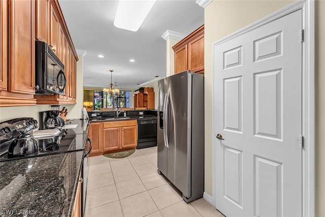 kitchen featuring sink, ornamental molding, light tile flooring, black appliances, and decorative light fixtures