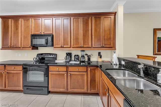 kitchen featuring light tile flooring, dark stone counters, sink, and black appliances