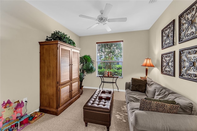 living room with ceiling fan and light colored carpet