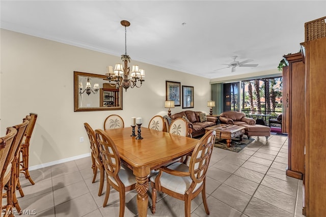 tiled dining area featuring ornamental molding and ceiling fan with notable chandelier