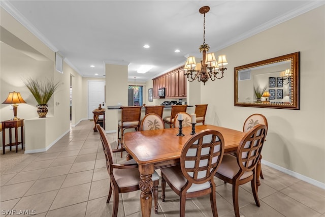 tiled dining area with ornamental molding and a chandelier