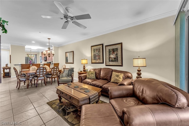 living room featuring crown molding, light tile flooring, and ceiling fan with notable chandelier