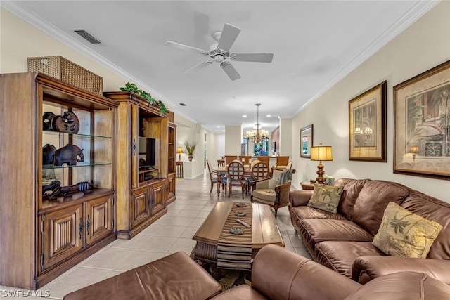 tiled living room featuring ornamental molding and ceiling fan with notable chandelier