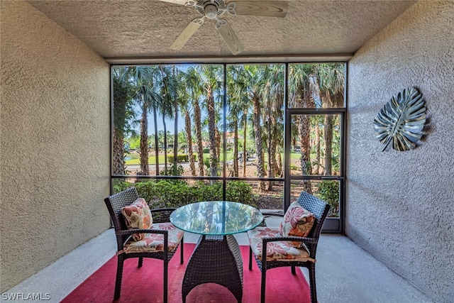 sunroom featuring ceiling fan