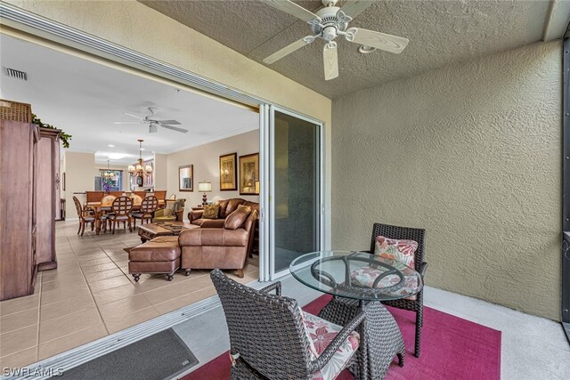 view of terrace featuring ceiling fan